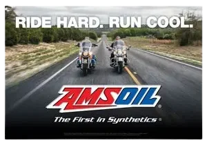 Motorcycles on road with AMSOIL logo.