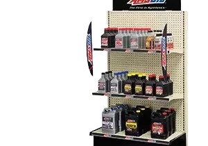 Display shelf with motor oil products.