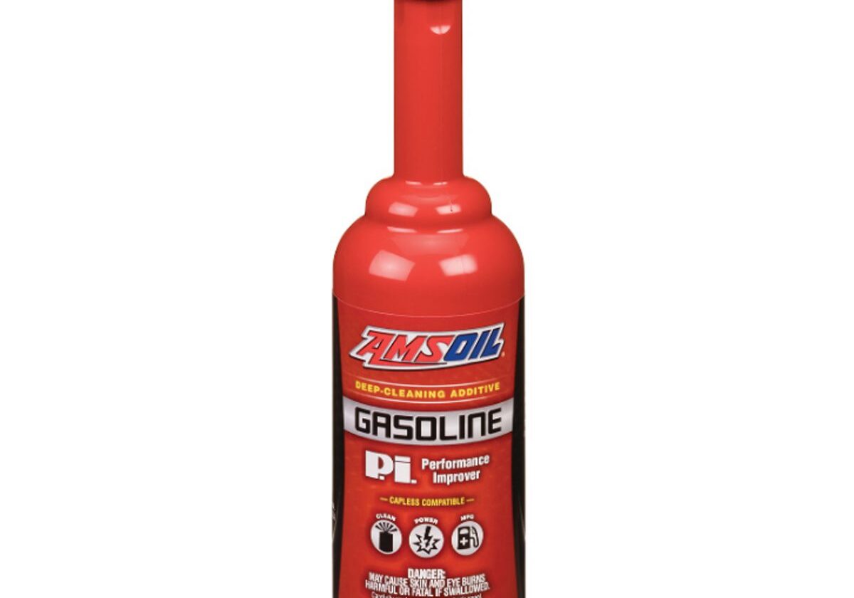 Red gasoline additive bottle with black cap.