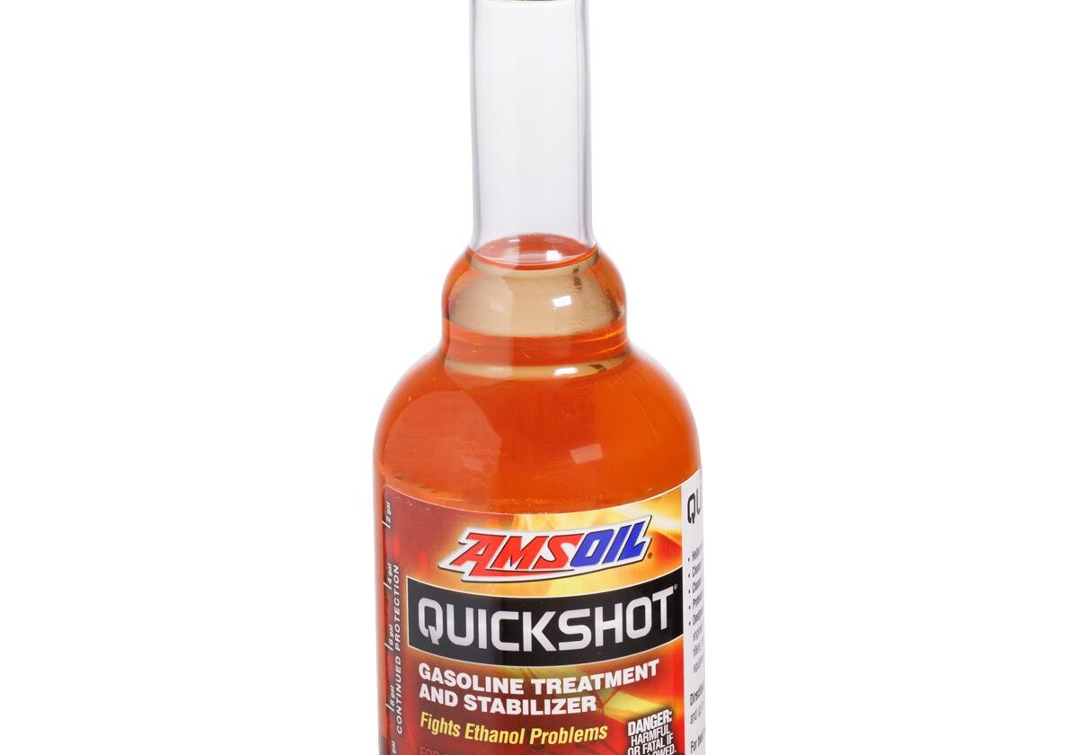Fuel treatment bottle with black cap.