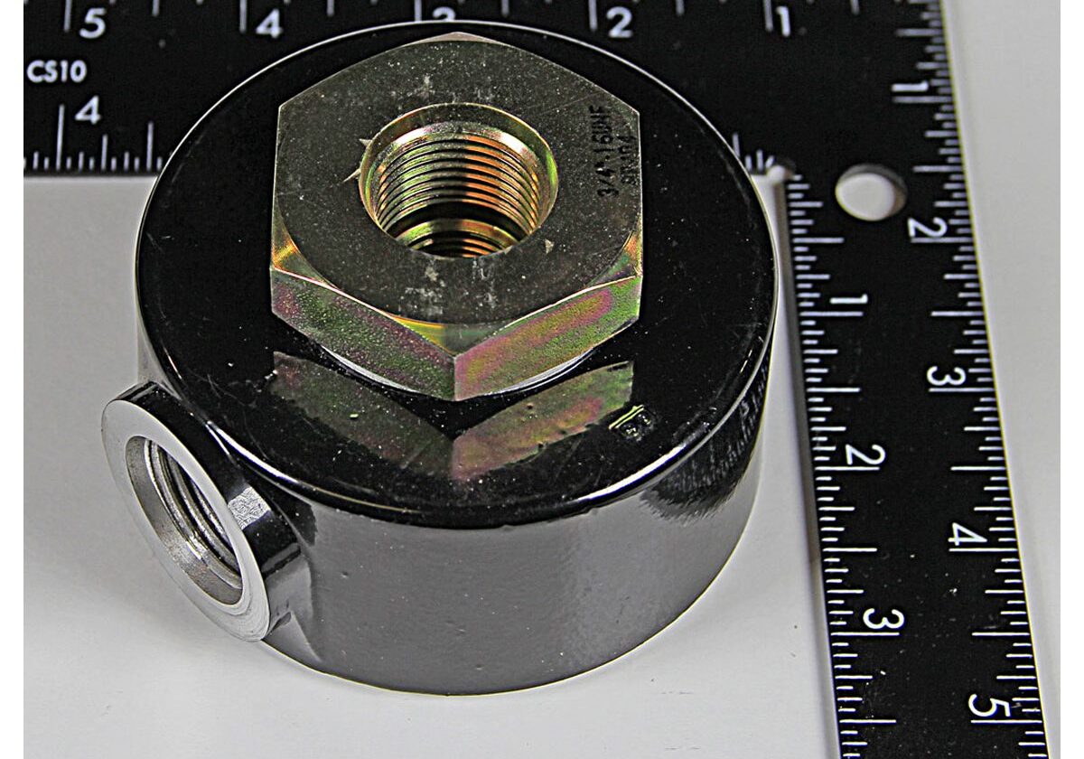 Black cylindrical object with metal hexagonal fitting.