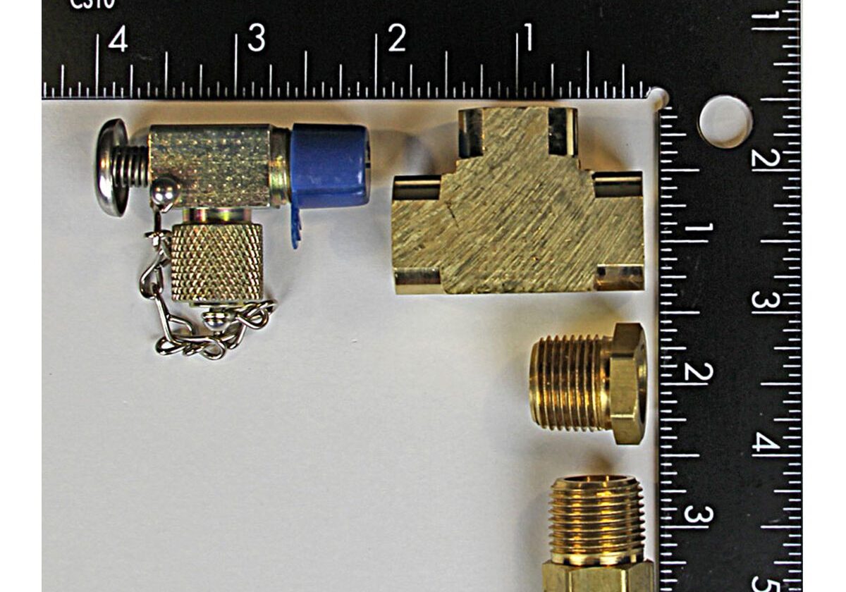 Ruler with metal connectors and fittings displayed.