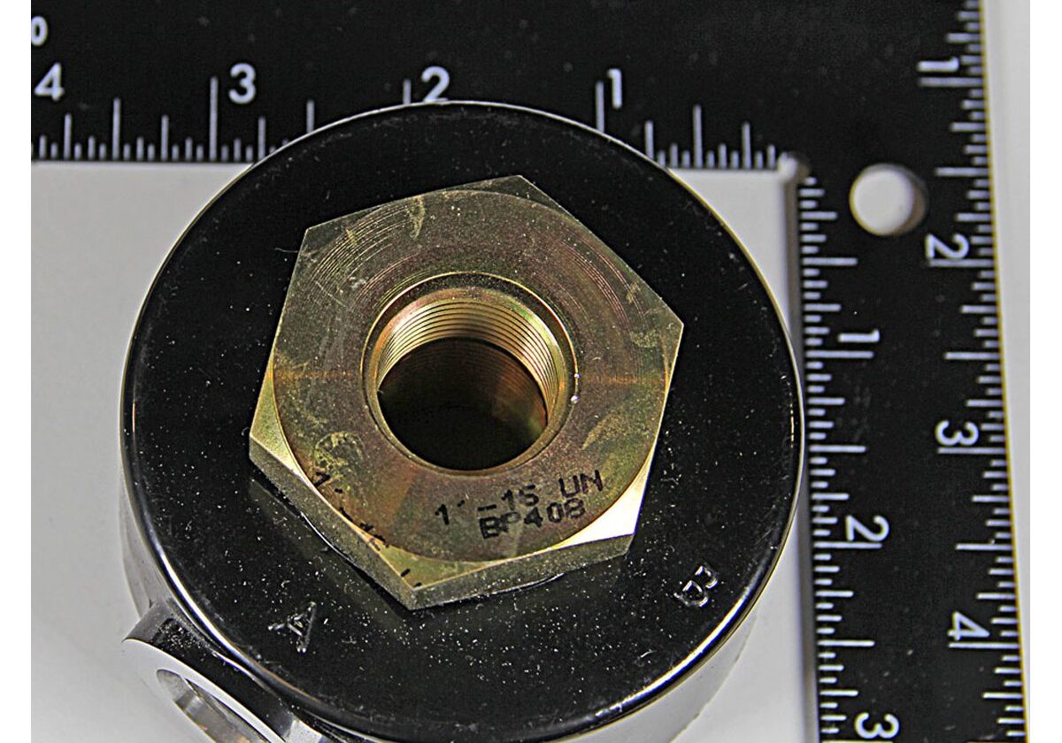 Metal fitting with ruler measurements in inches.