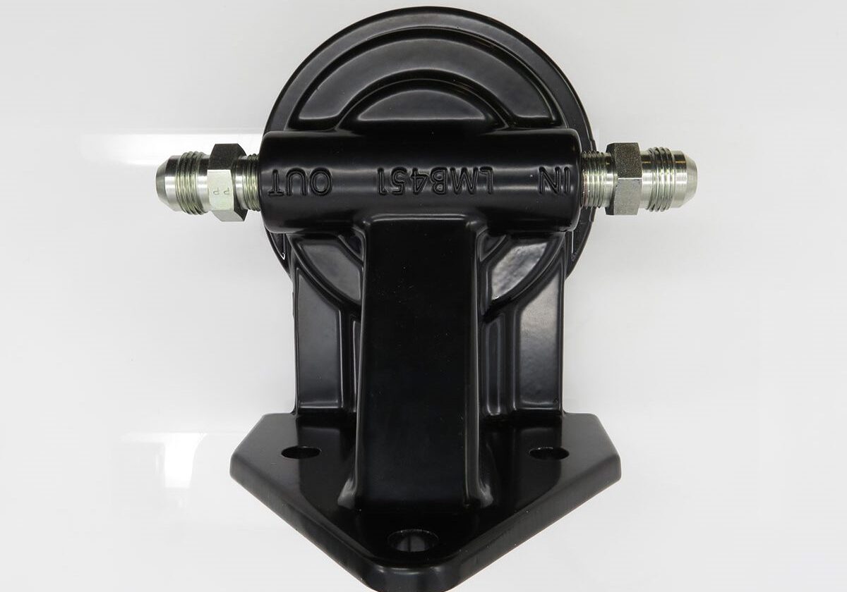 Black industrial mounting bracket with connectors.