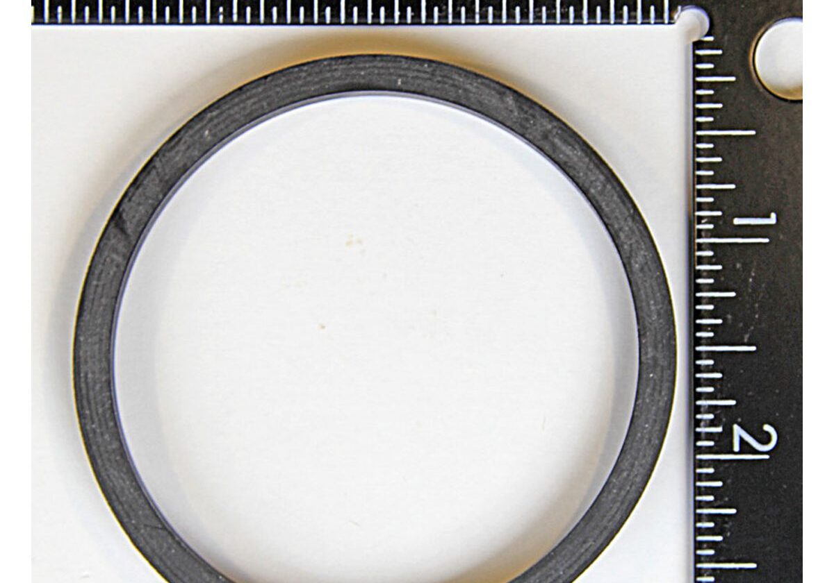 Black ring with measuring rulers nearby.