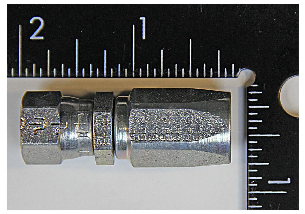 Metal connector fitting with measurement scale.