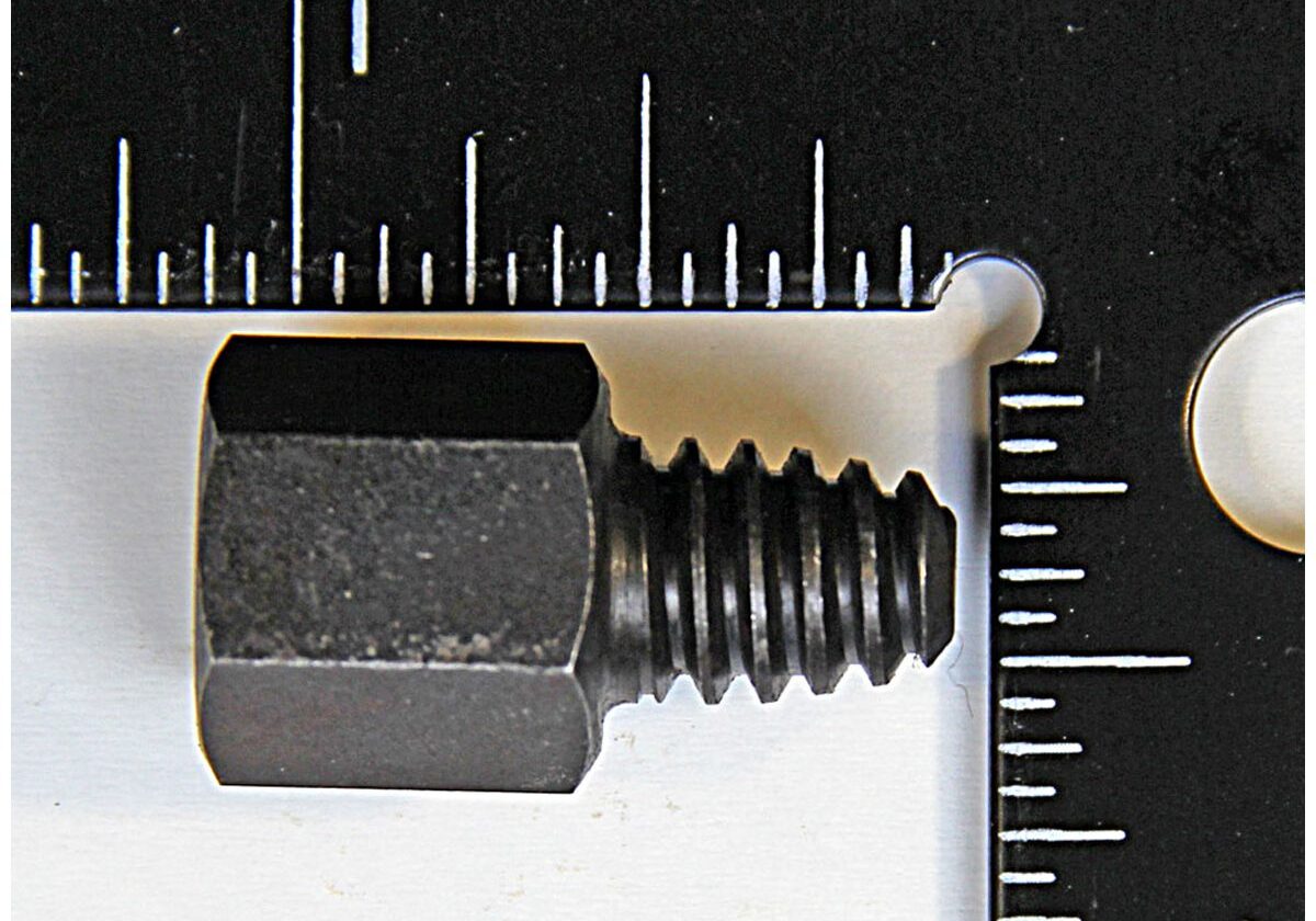 Hex bolt measured with a ruler.
