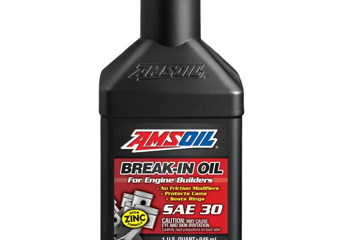 Engine oil bottle with red cap.