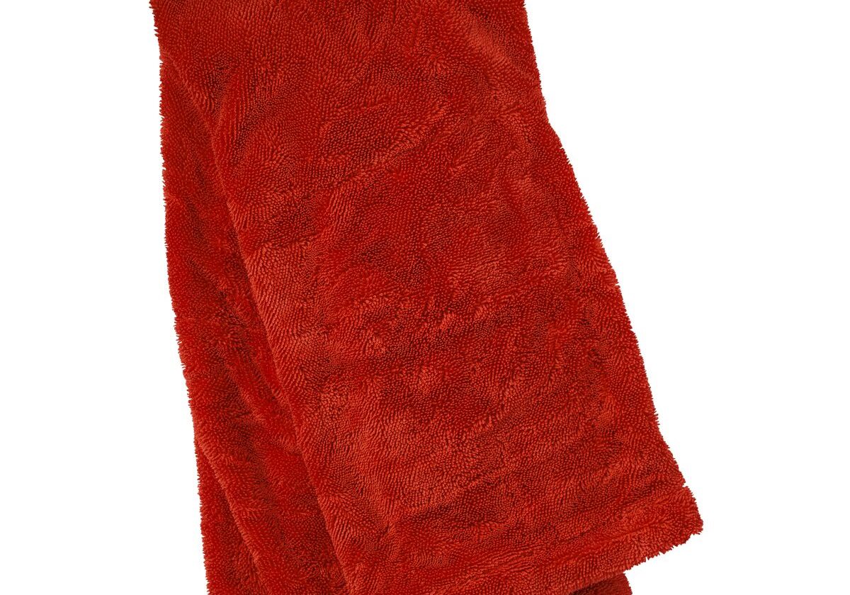 Red plush towel folded neatly.