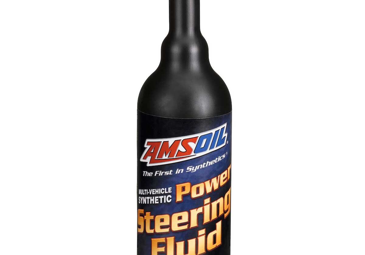 Black bottle of power steering fluid.