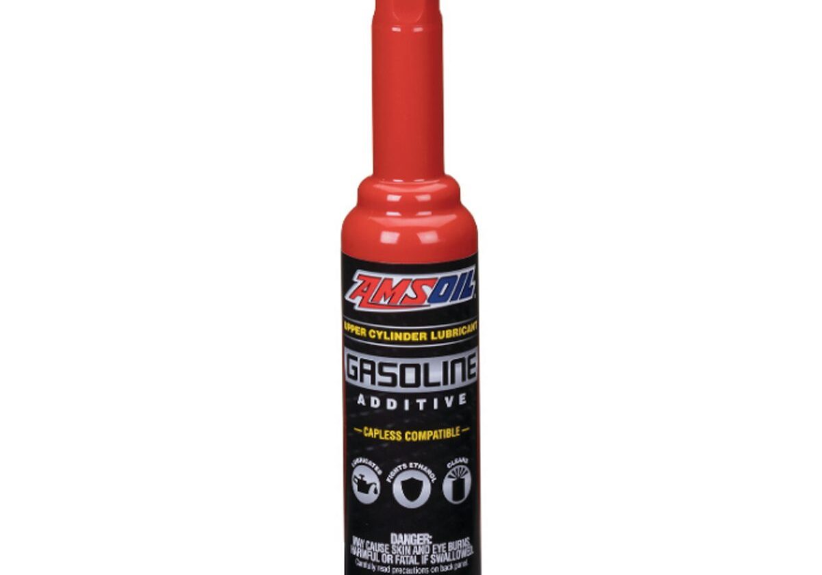 Red gasoline additive bottle with black cap.